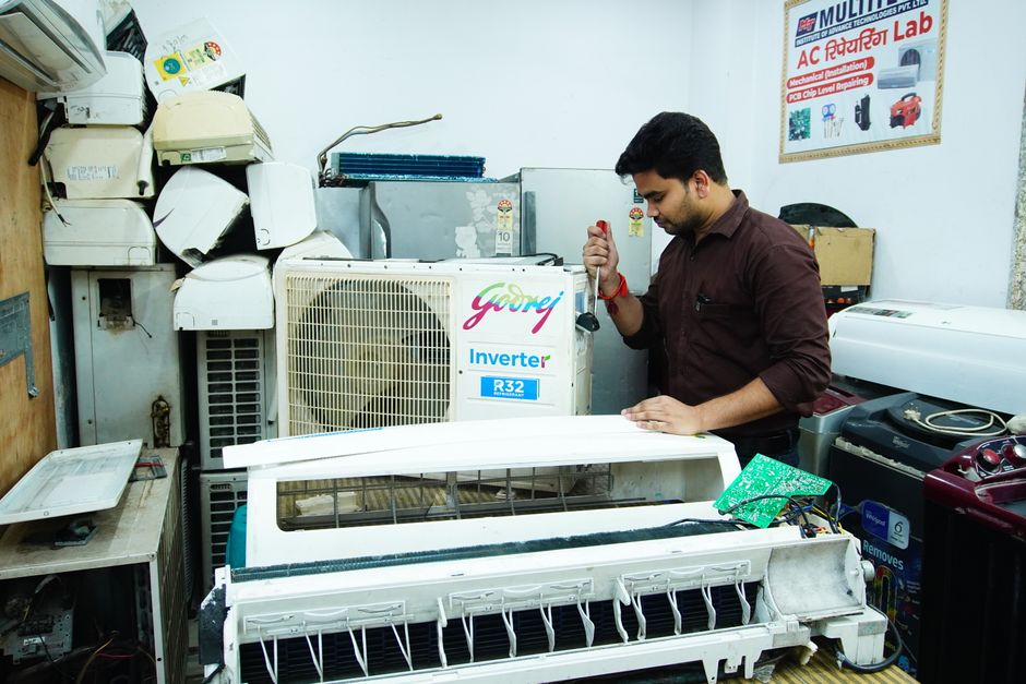 Technician performing AC installation